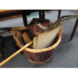Three various early 20th century bows, various sporting items and baskets etc