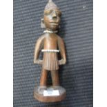 An African carved wood figure 26cm high