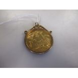 A 9ct plain scroll topped pendant mount containing a Victorian Jubilee Head £2 piece dated 1887,