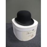 A bowler hat in a hat box