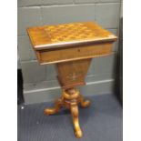 A late Victorian walnut and inlaid games table with fold-over top on carved legs, 77cm high