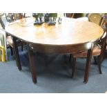 A George III mahogany D end dining table with one leaf