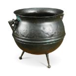 W.A.S. Benson, a copper cauldron shaped coal scuttle, with swing handle raised on ball feet 34 x