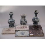 A pair of small Delft bulb vases (damaged), plates, tiles etc.