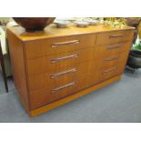 A Danish style teak double bank chest of eight graduated drawers, 76cm high, 142cm wide