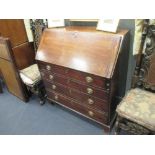 A George III mahogany bureau, with oval brass handles, on square bracket feet, 111cm h x 104cm