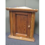 A Victorian stripped pine wall hanging corner cupboard, 59 x 54cm