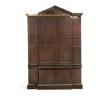 A George II mahogany breakfront cabinet, circa 1750, the triangular pediment above four triple