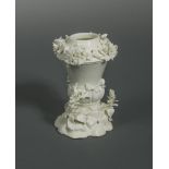 A Saint-Cloud blanc de chine pastille burner, circa 1730-50, the tapering body with a lower band