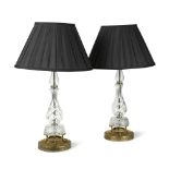 A pair of cut glass table lamps, the baluster columns to gilt metal bases with black fabric