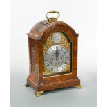 A mahogany bracket clock circa 1800, the single pad top with handle above 7inch break-arch brass