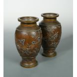 A pair of Japanese Meiji bronze and mixed metal inlaid pedestal baluster vases, decorated with