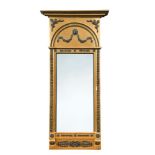 A 19th century gilt framed pier glass, black painted gesso moulded relief decoration, to an arched