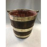 A 19th century oak and brass bound peat bucket, with swing handle 32cm (12in)