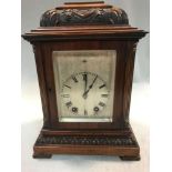 A late 19th century mahogany mantel clock, the moulded rectangular case with scroll engraved