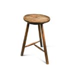 A small early 19th century ash and elm stool or cricket table, 80 x 38cm (31 x 15in)