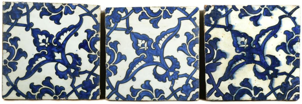 Three mid 16th century Iznik 'Dome of the Rock ' tiles each painted in blue on the diagonal with