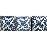 Three mid 16th century Iznik 'Dome of the Rock ' tiles each painted in blue on the diagonal with