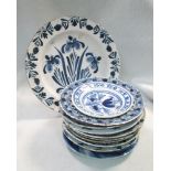 An 18th century Delft blue and white plate, decorated to the centre with irises, the border with