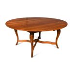A 20th century French cherry wood circular table, on swept legs 76 x 169cm (30 x 66in) Provenance: