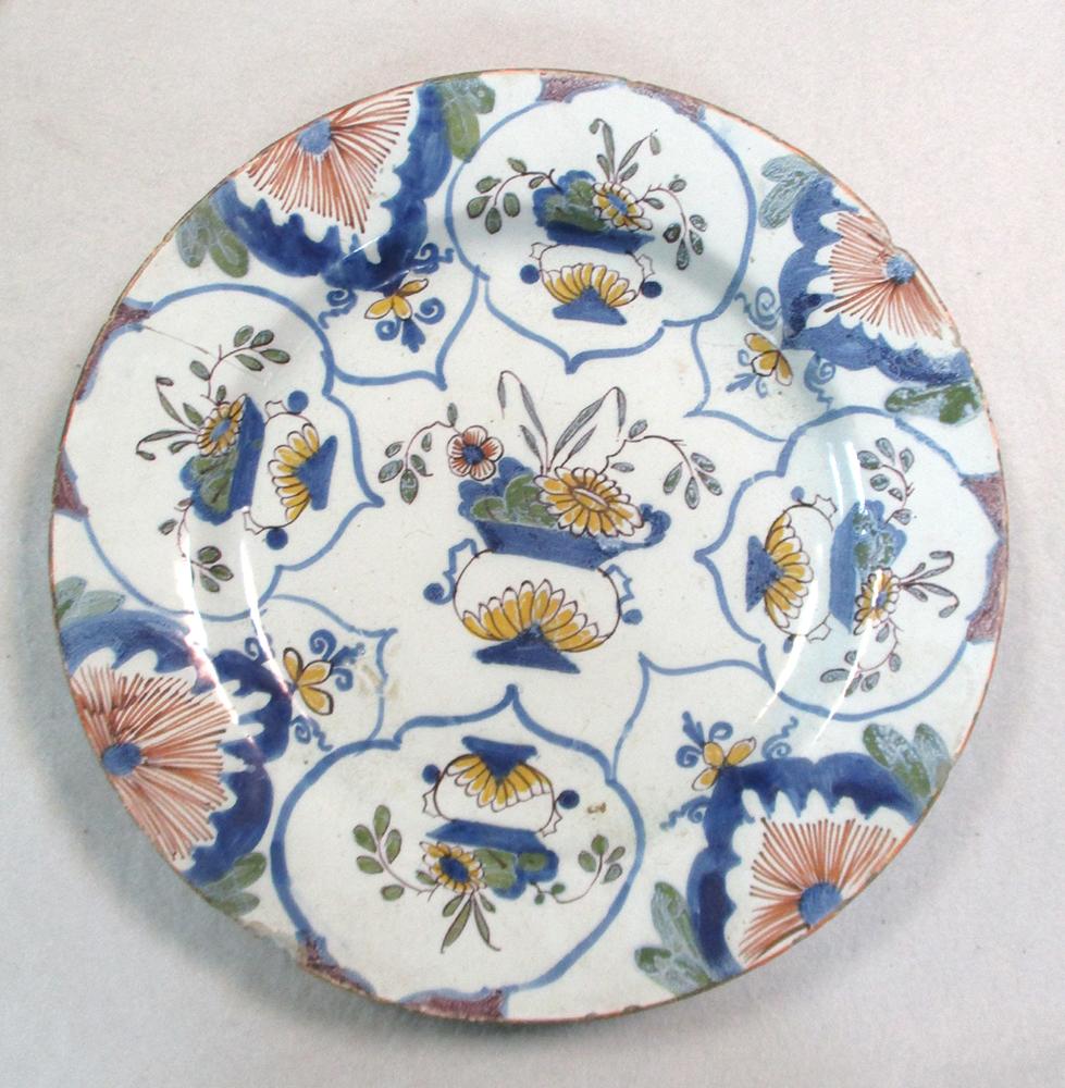 An 18th century Delft blue and white charger, decorated with a woman holding a cornucopia, 35cm - Image 12 of 13