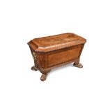 A late Regency mahogany wine cooler, of sarcophagus shape, with a lead lined interior, brass side