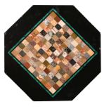 A 19th century octagonal black marble and pietra dura chess board table top, the playing surface