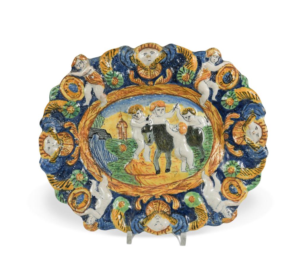 An 18th century Angarano maiolica dish, moulded and painted in green, yellow and blue with four