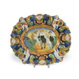 An 18th century Angarano maiolica dish, moulded and painted in green, yellow and blue with four