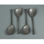 A set of four pewter spoons, with seal top handles and pear shaped bowls, stamped