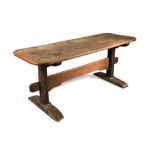 An oak trestle style refectory table, with cleated ends and rounded corners 73.50 x 176 x 64cm (29 x