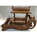 A mahogany and stag antler model Chinese style temple or boat structure, early 20th century, with