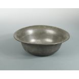 An 18th century pewter bowl of plain form, the lip inscribed Lochmaben Free Church 1843. (The Free