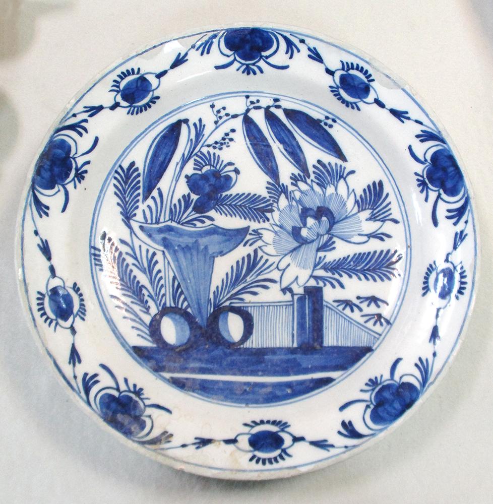 An 18th century Delft blue and white charger, decorated with a woman holding a cornucopia, 35cm - Image 10 of 13