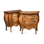 A pair of late 18th century Lombardy walnut and marquetry inlaid bombe commodes, inlaid in bone with