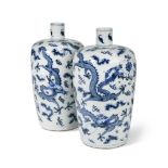 Two similar blue and white dragon vases, Qing Dynasty, 19th century, with cylindrical necks