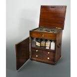 A George III mahogany travelling apothecary box, with brass carrying handles, the hinged top and
