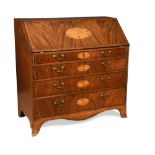 A George III mahogany and inlaid bureau, with a fitted interior and red tooled leather faced
