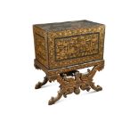 An early 19th century Chinese Export black lacquer chest, on an X - frame folding stand, decorated