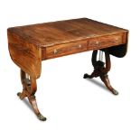 A Regency rosewood sofa table, early 19th century, inlaid with anthemion and line borders, fitted