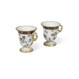 A pair of Sevres ice cups, circa 1793-1800, each decorated with scattered floral sprays, beneath