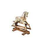 A late Victorian painted rocking horse, on trestle base, worn paint and lacking both saddle and