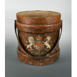 A 19th century leather shot carrier, the circular bucket with Royal Crest in polychrome, lacking