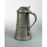 A large 18th century Scottish pewter lidded tankard, with uptapering ringed body with stamp to