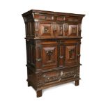 A 17th century and later Flemish walnut and oak chest, in two halves, with moulded decoration,