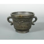 An Italian bronze mortar, dated 1621 but probably 19th century, with serpent coil handles, vine