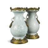 A pair of late 19th century ormolu-mounted craquelure glazed Chinese vases with lizard moulded