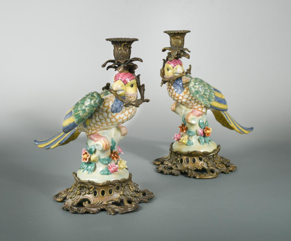 A pair of gilt metal mounted porcelain parrot candlesticks, with applied floral rock work bases with - Image 2 of 2