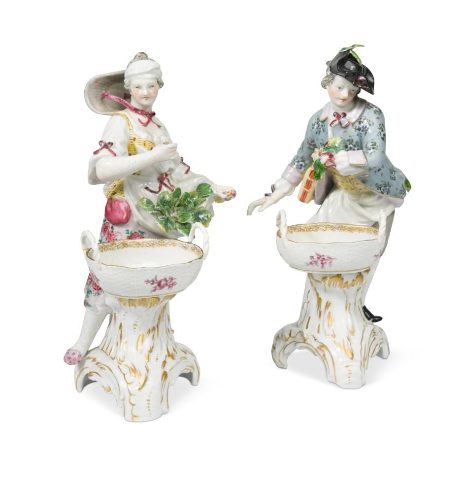 A pair of Berlin figural table salts, modelled as a gallant and his companion, both dressed in