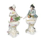 A pair of Berlin figural table salts, modelled as a gallant and his companion, both dressed in